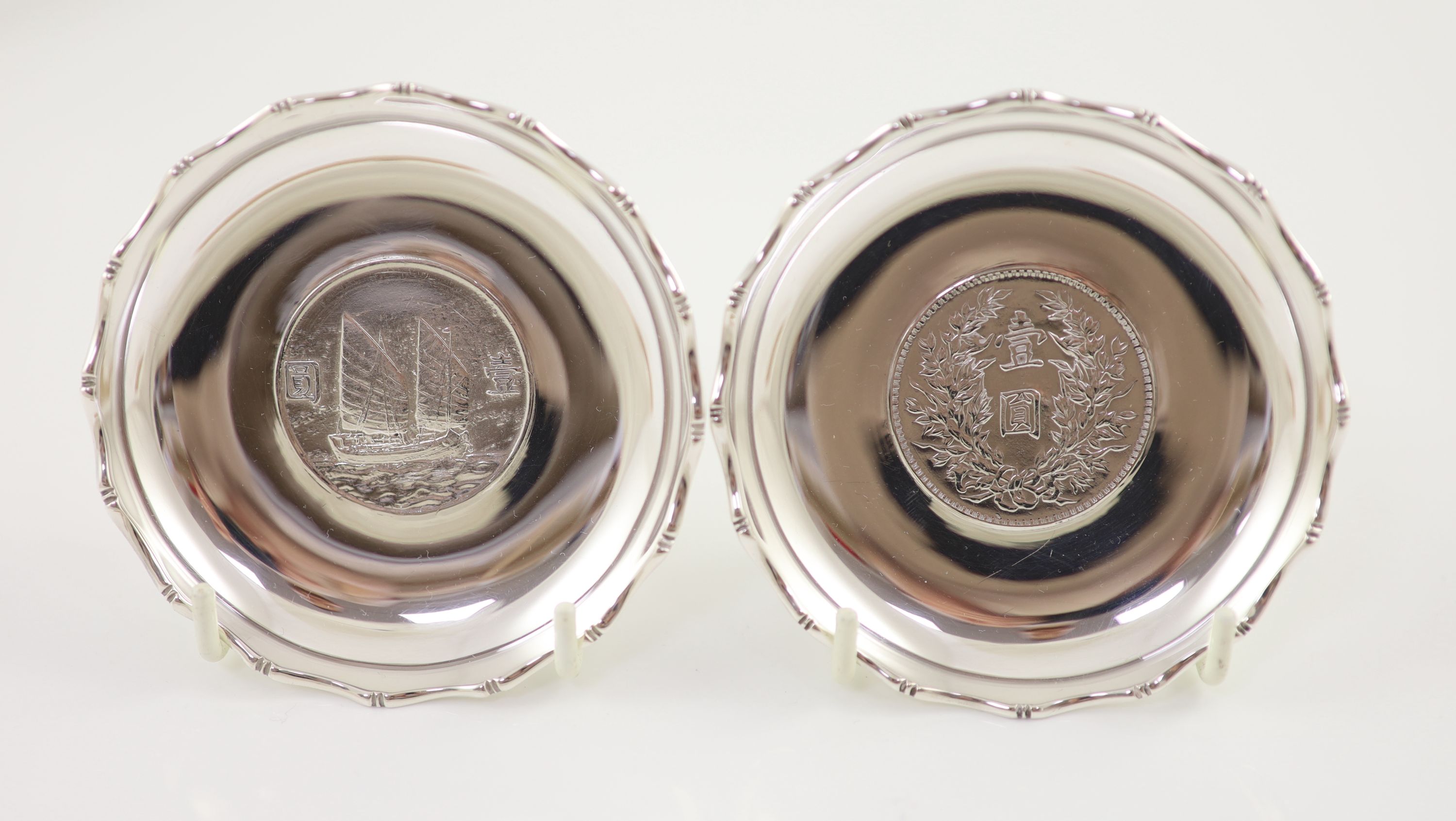 Ten early 20th century Chinese Export small Sterling silver coin inset dishes with shaped 'bamboo' edges, by Tach Hing, Hong Kong,